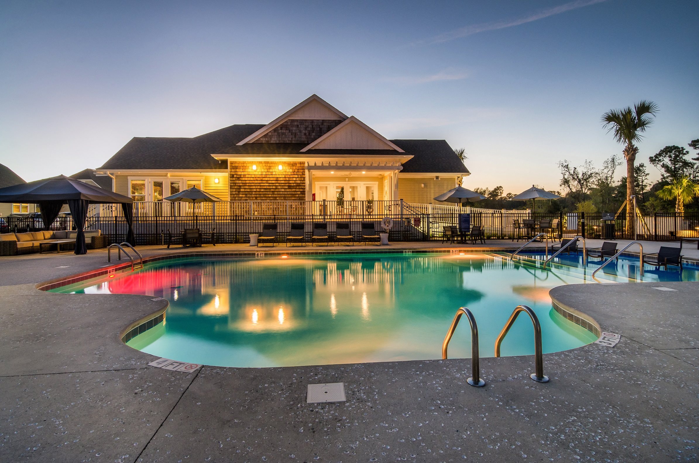 Apartments for Rent in Wilmington NC - Myrtle Landing - Sparkling Pool Surrounded by Lounge Seating and Private Cabanas